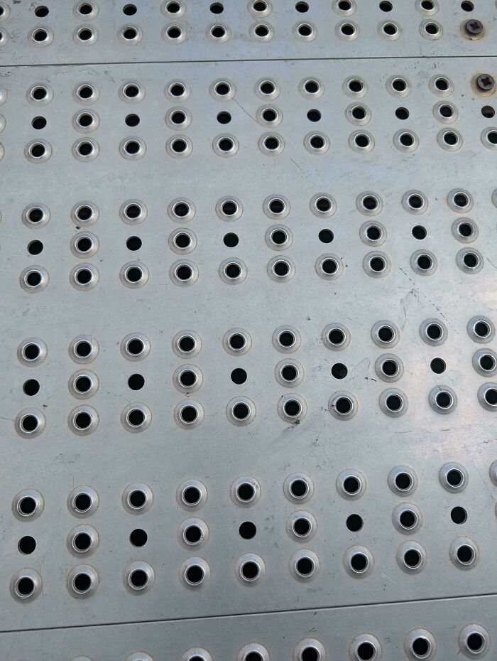 Why Does This Carnival Floor Have Two Types Of Holes?