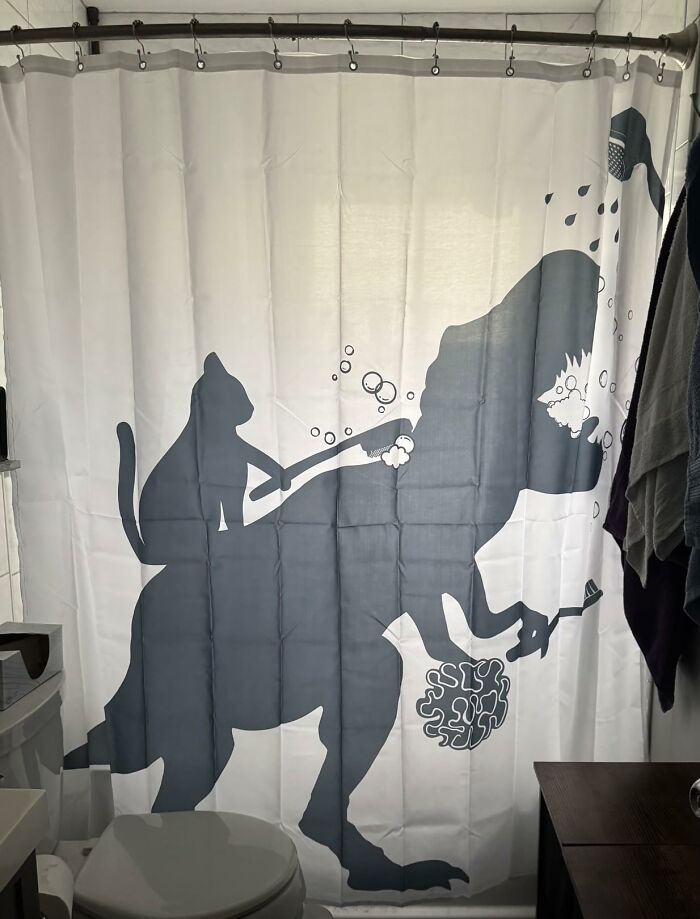 This Cat-Dino Shower Curtain Is The Mashup We Didn’t Know We Needed