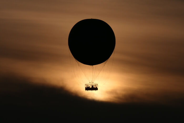 Balloon Eclipse: Flying Into Sunset