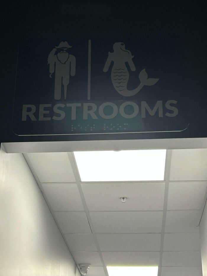 Braille Printed On A Sign For The Bathroom… That’s Over 11 Feet In The Air
