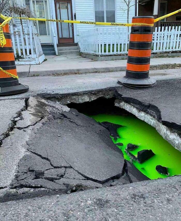 Mysterious Opening in the Pavement: Portal or Pothole?