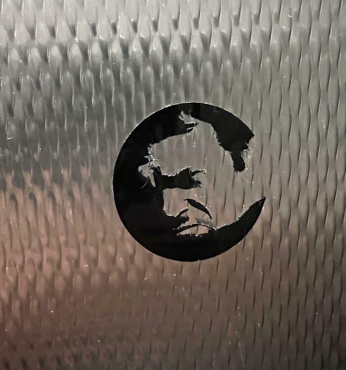 Ripped Sticker Looks Like Someone Grimacing Hard