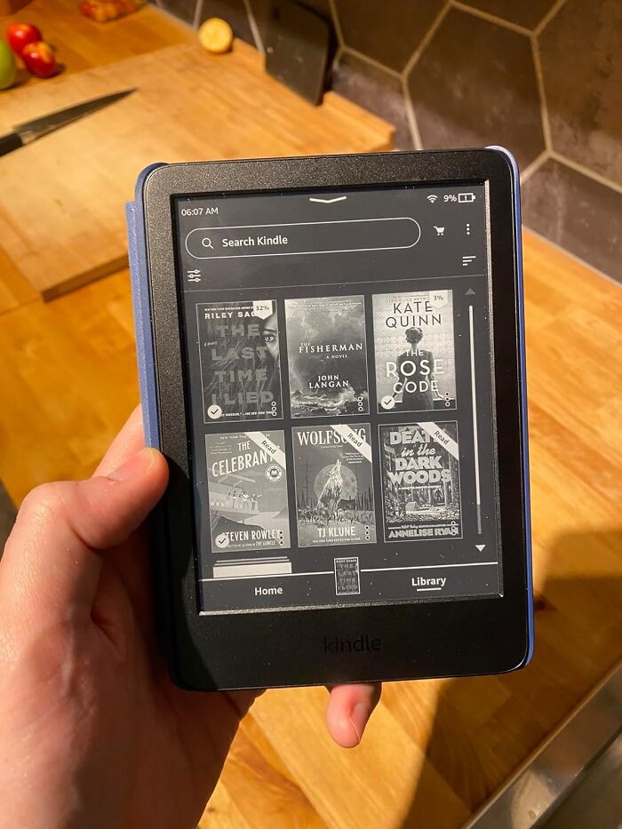 For The Dad Still Lugging Novels Around, This Amazon Kindle Packs A Whole Library In His Pocket