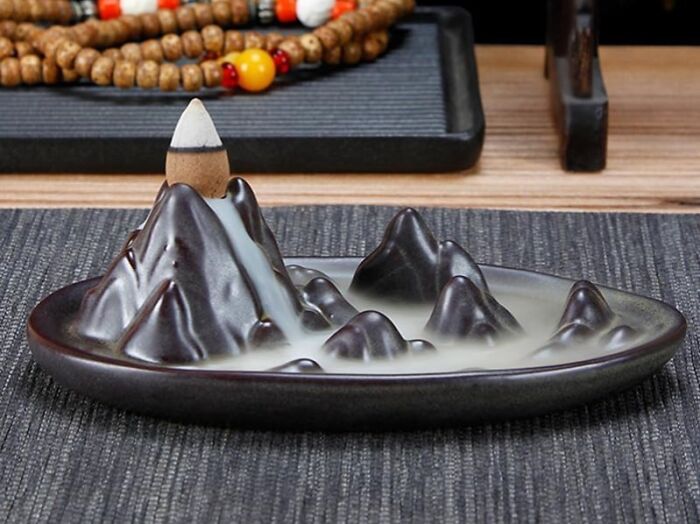 This Backflow Incense Burner Will Have Dad Hypnotized Like He’s Watching A Tiny Smoky Waterfall
