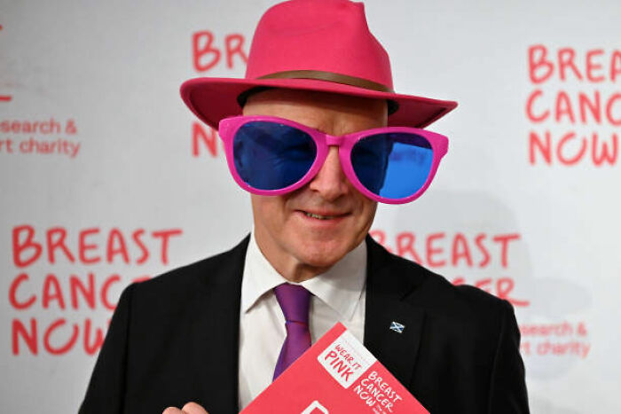 First Minister John Swinney Strikes a Pose in the Scottish Parliament