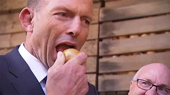 Former PM Tony Abbott Chomping a Raw Onion Like It’s No Big Deal