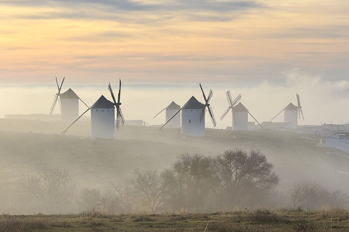 Windmills Chilling In The Foggy Morning