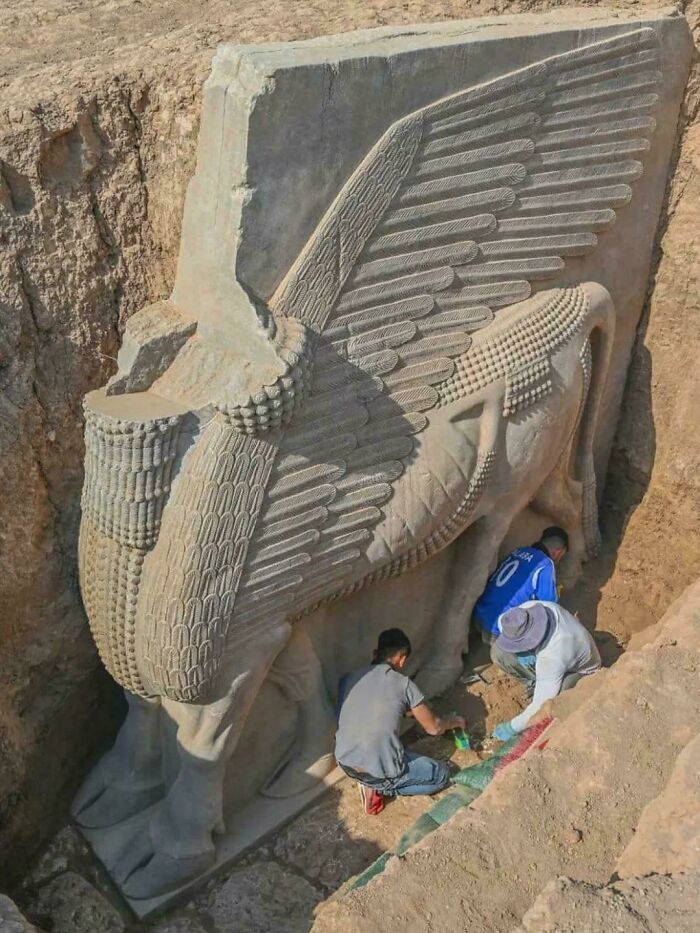 2,700-Year-Old Assyrian Lamassu Being Dug Up In Iraq—Majestic Beast Alert!