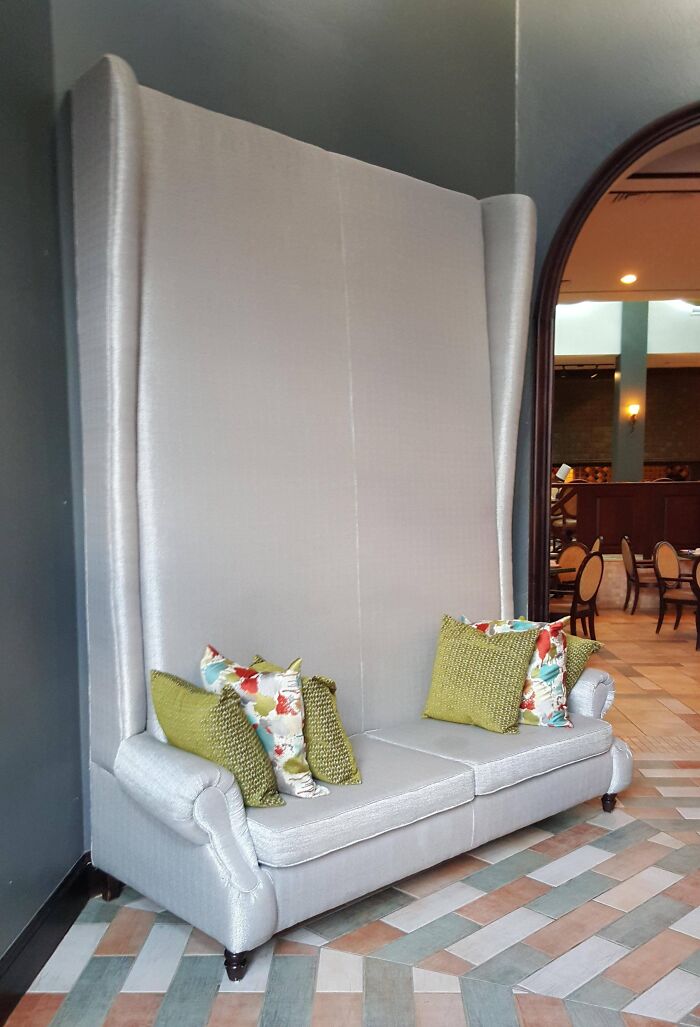 This Couch Has a Bonkers Tall Back. Good for Hide and Seek?