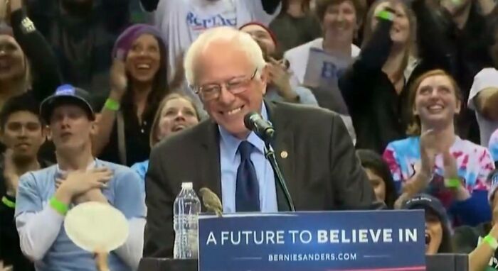 Bernie Smiling At A Tiny Bird Buddy