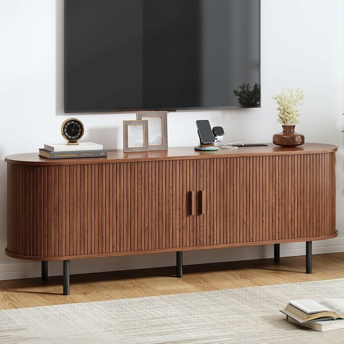 This Fluted TV Stand Hides All the Cables and Powers Up Your Tech Like a Magic Butler