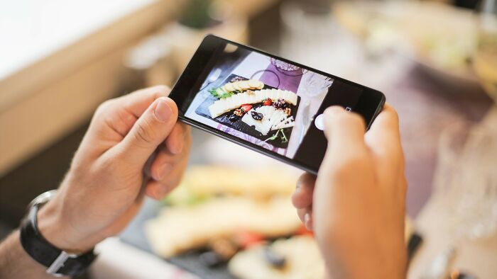 Food pics alert! They spend five minutes setting the perfect lighting and ask you to be their photo assistant.