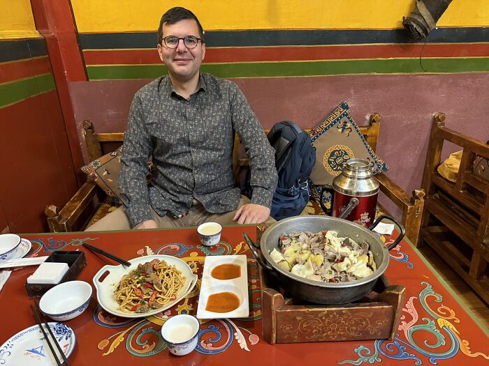 Digging into Yak Dishes, Lhasa, Tibet