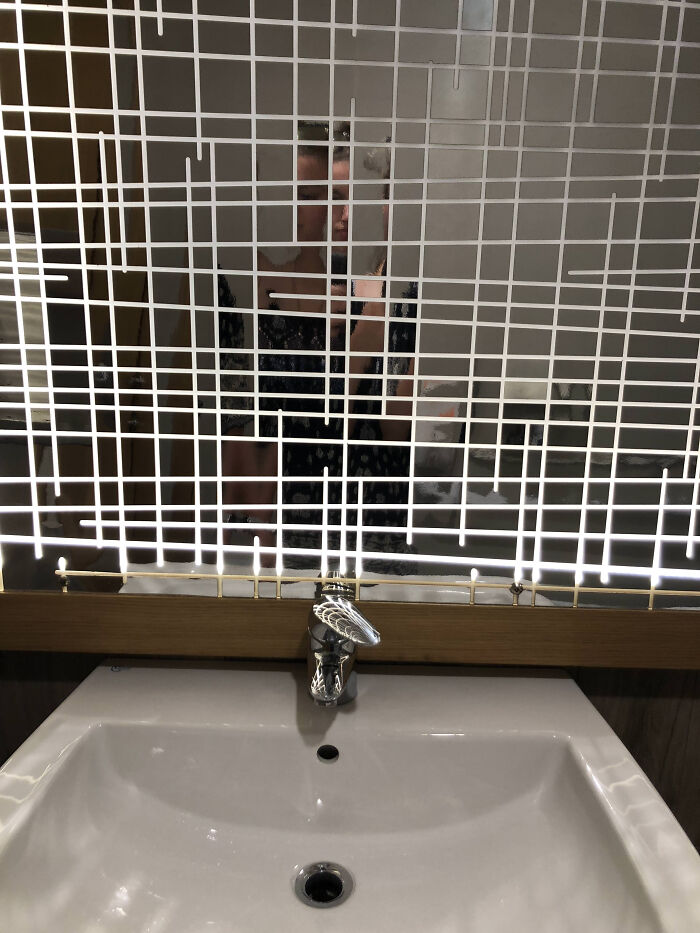 This Bar's Bathroom Mirror Is Something Else