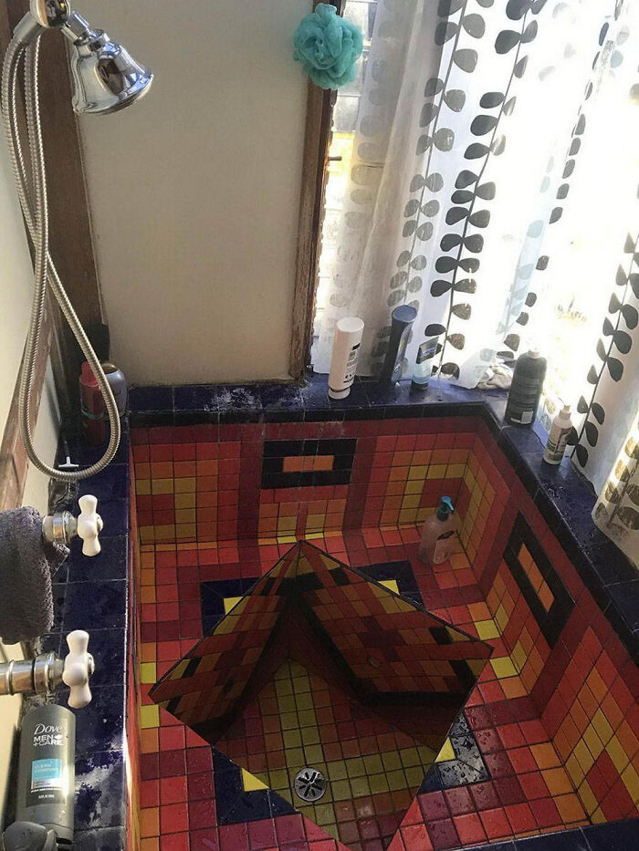 A Shower With A High Step, Sharp Edges, And A Hole. Yikes.