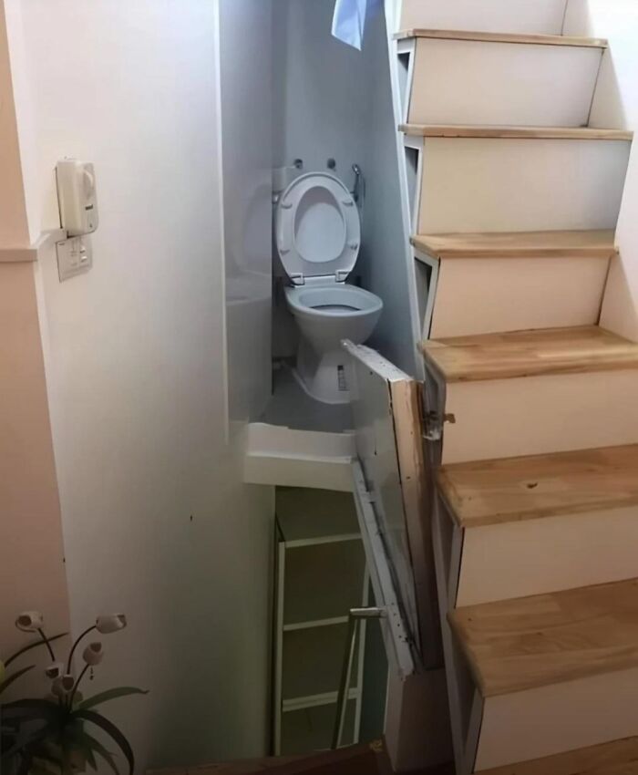 Hideaway Bathroom Tucked Behind Stairwell... Sorta