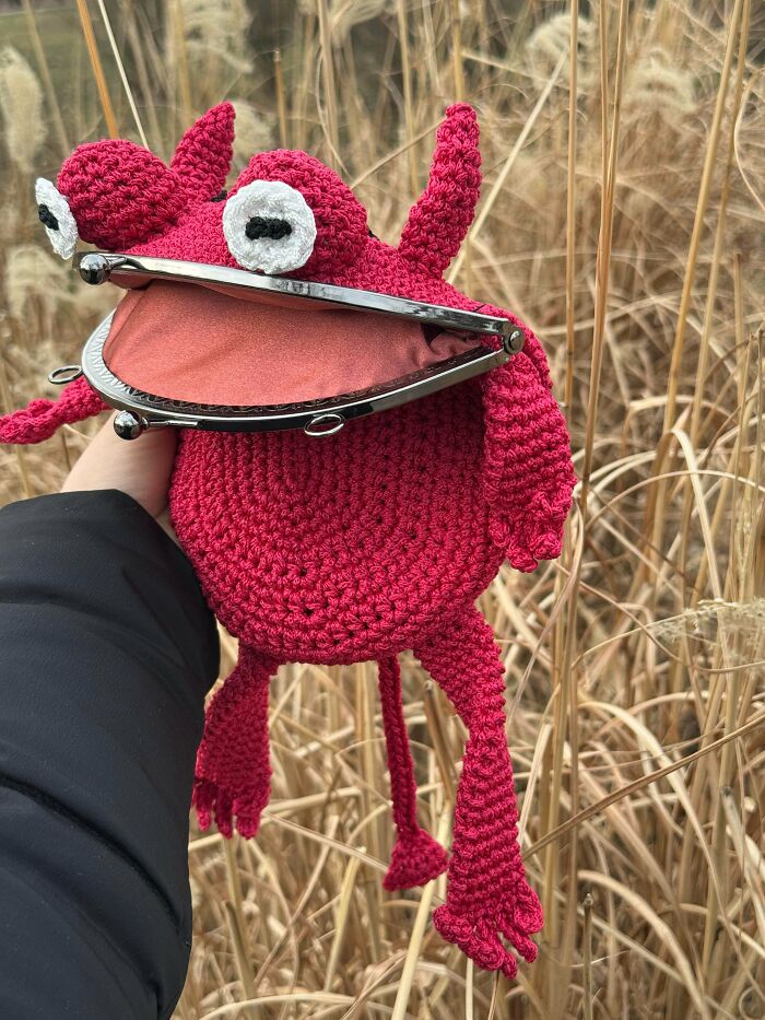 I crocheted a frog demon bag to guard my goblin treasures and whisper suspicious things at night.