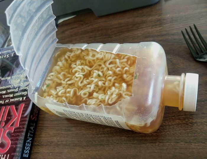 Bad Instant Noodles Eaten Out Of Old Pedialyte Bottle At Desk