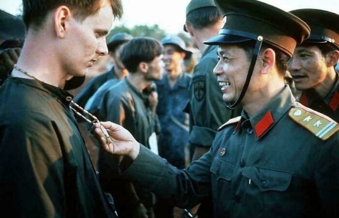 North Vietnamese Officer Laughs at Captured Soldier’s Peace Necklace, 1973