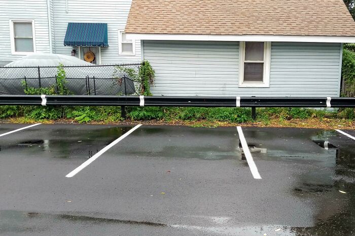 Parking Lot Lines That Actually Climb Up the Barrier
