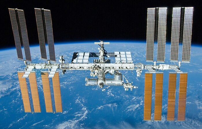The International Space Station: Humans Living Orbiting Our Tiny Blue Dot