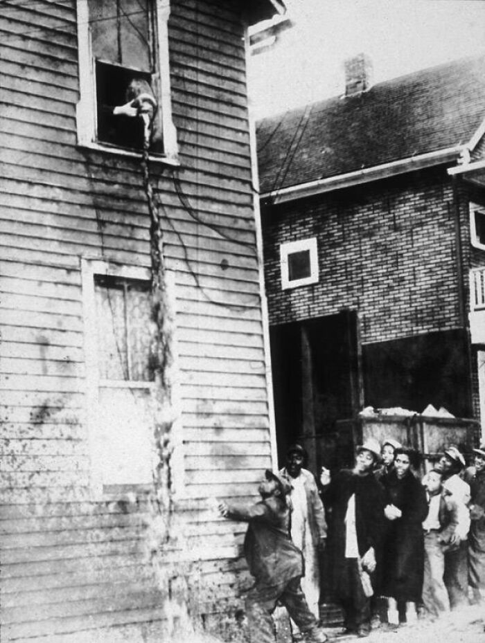 Man Catching Booze From Prohibition Agent Window, 1925 (Smooth Catch)