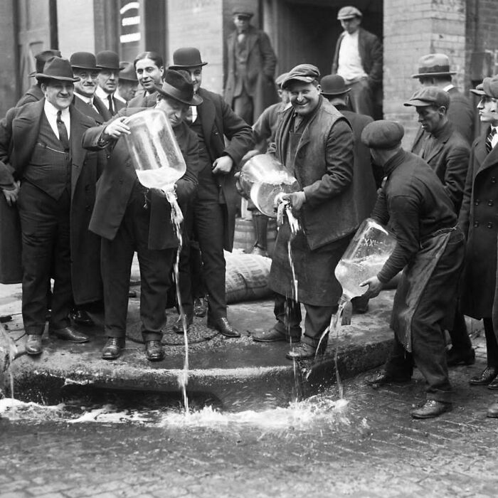 Policeman Dumping Alcohol In Gutter, 1922 New York (Prohibition Enforcement)