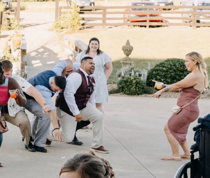 Caught Husband With A Cramp Mid-Dance, Guest Pointing And Laughing