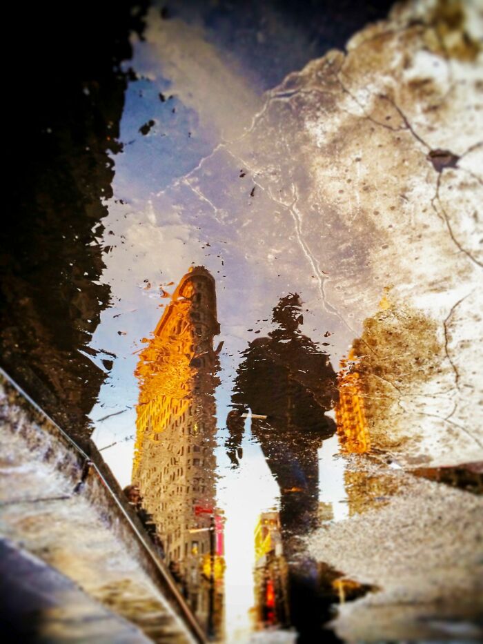 "Puddle Scape: Flatiron Crossing" By Pierre Hauser