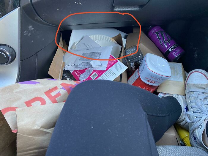 His Car’s Full Of Junk, But At Least The Trash Can Is Empty… (Or Is It?)
