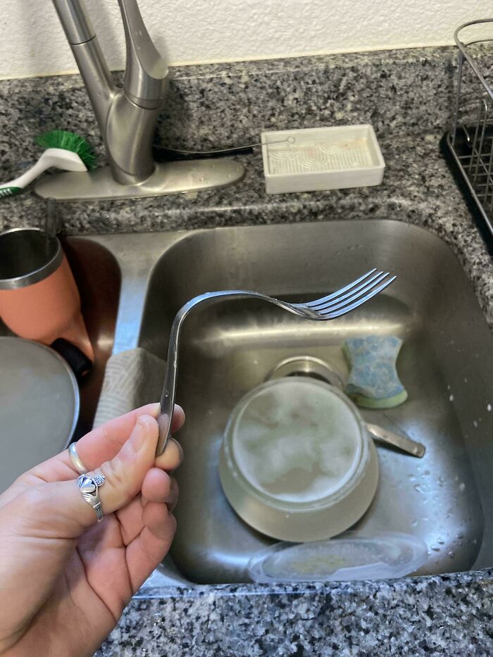 Instead Of Wrapping His Fork, He Bent It To Fit In The Tupperware. Genius?