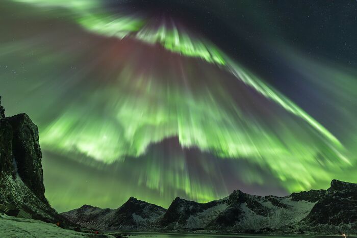 "Northern Lights Light-Up At Norway’s Devil’s Teeth" By Julien Cadena