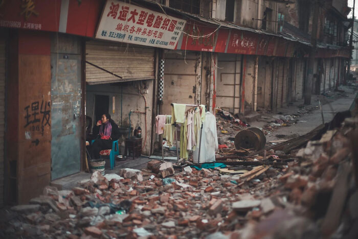 Silent Resilience: Life Keeps Going Amid City Changes