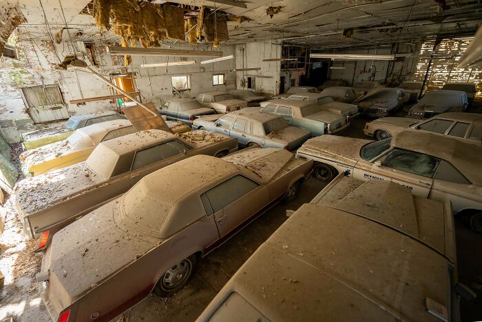 Vintage Cars Forgotten Inside a Crumbling Warehouse