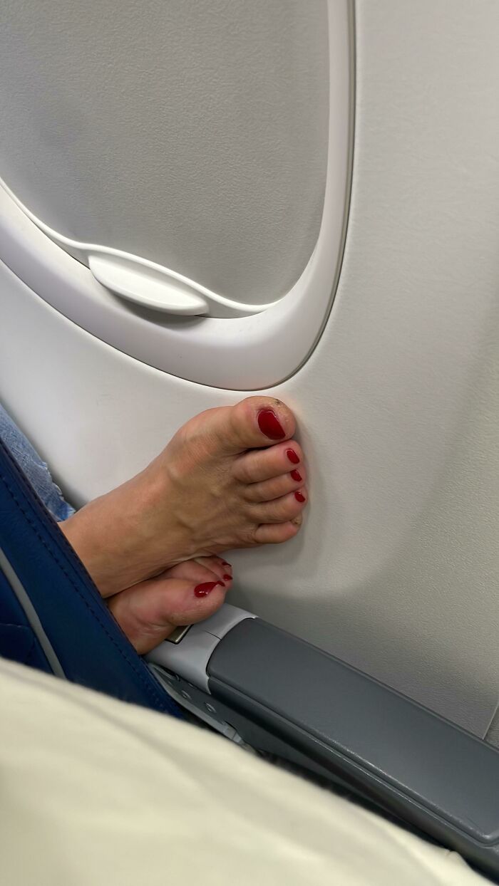 Boarded a 5-Hour Flight and Lady Sneaked Her Bare Feet to Push Off My Armrest—Gross!