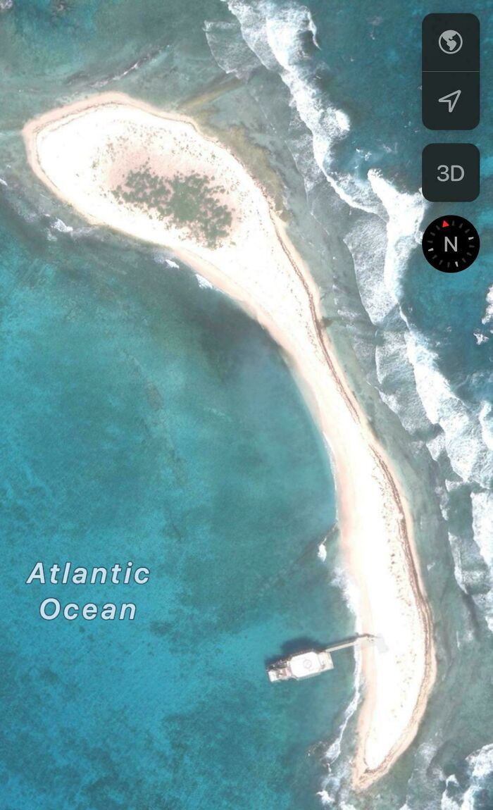 Tiny Caribbean Island With Nothing But A Docked Helipad