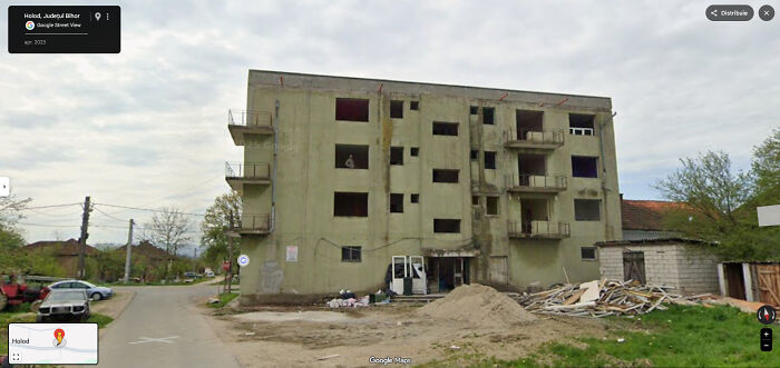 Creepy Dude Watching Google Maps Car From Abandoned Building Balcony