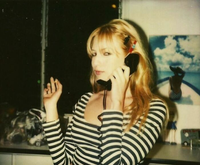 Smoking and Chatting on a Sleek Wired Phone, because Why Not?