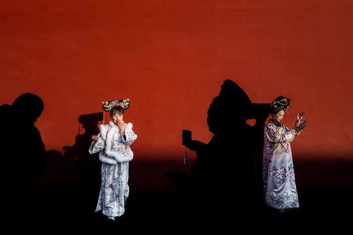 Tourists Rocking Traditional Red at the Palace