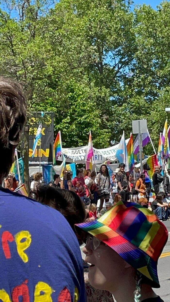 Flag Holders vs. Homophobic Protesters at Pride Parade — Take That!