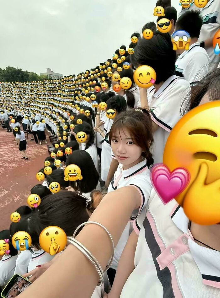 Girl Respects Classmates' Privacy With Stickers on Grad Photo