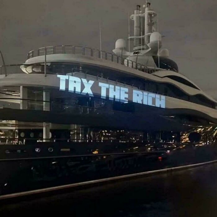 Artist Projects ‘Tax The Rich’ On Zuckerberg’s Yacht Like A Boss