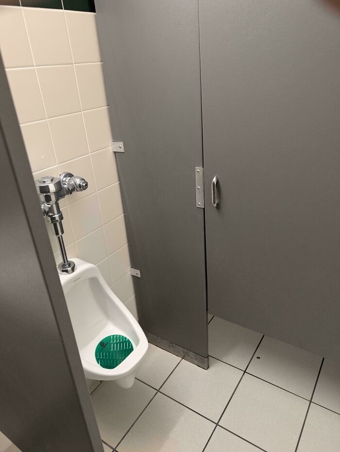 Urinal Right In Front Of Stall Door? Yep.
