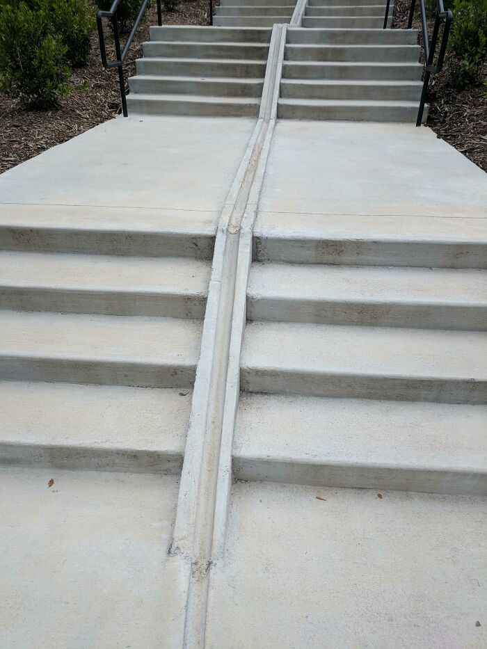 This Staircase Has a Groove to Roll Your Bike Up with Ease