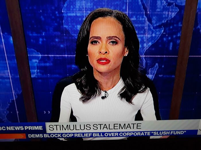 Tiny Newscaster With Huge Head?