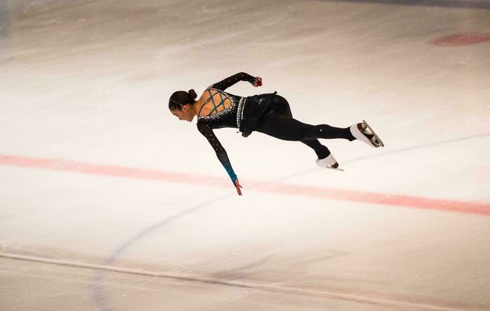 Figure Skater Gliding Parallel To The Ground