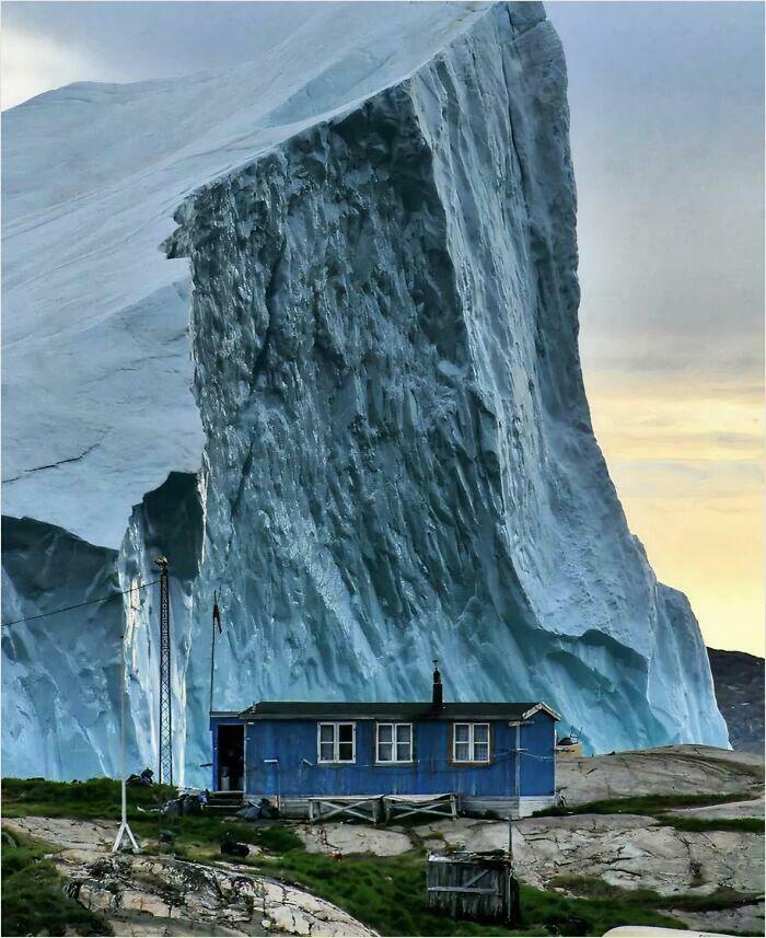 Iceberg Slow-Passes A House In Greenland. Chilly!