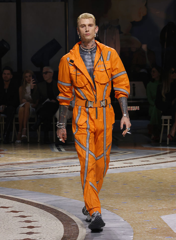 Machine Gun Kelly’s Neon Orange ‘Prison Jumpsuit’ Look Got Roasted Hard